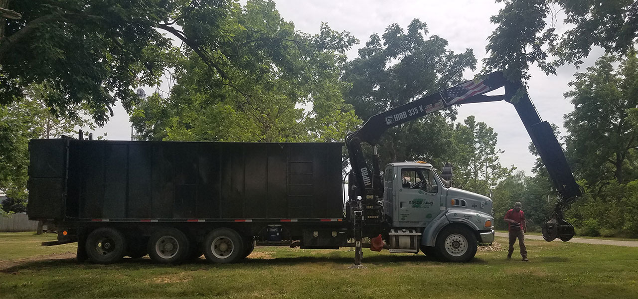 Arbor Way truck pulling up with a load of mulch